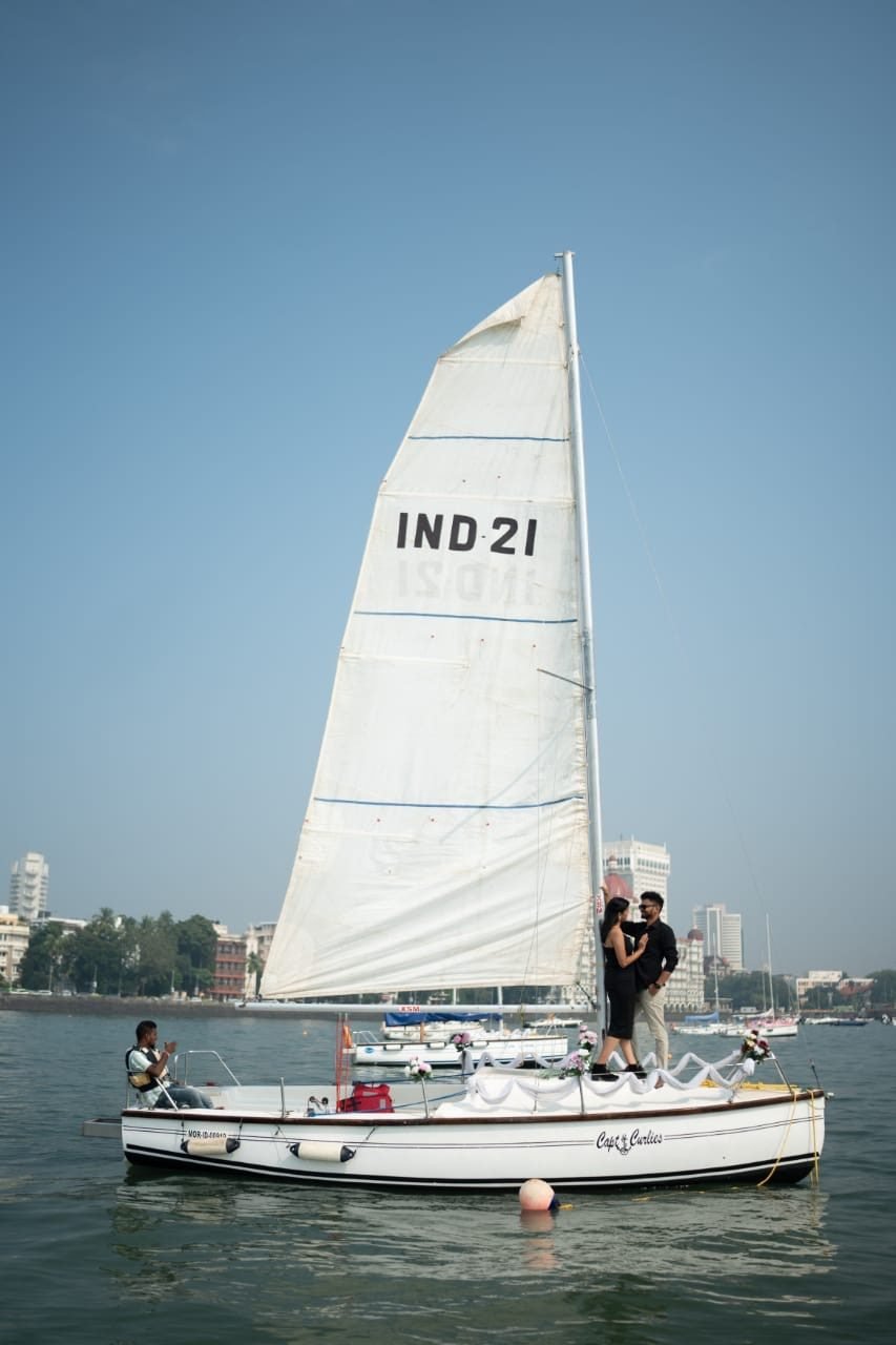 Sailboat with skipper leaving the Gateway of India