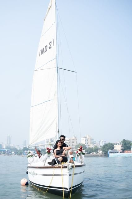 Couple silhouette against the sail