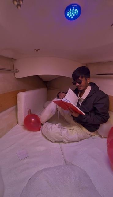 A quiet moment reading in the cabin onboard